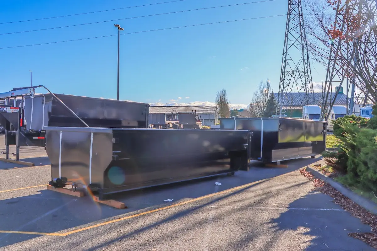 Roll-off dumpster ready for waste disposal at job site for Construction Dumpster Rental in Townsend